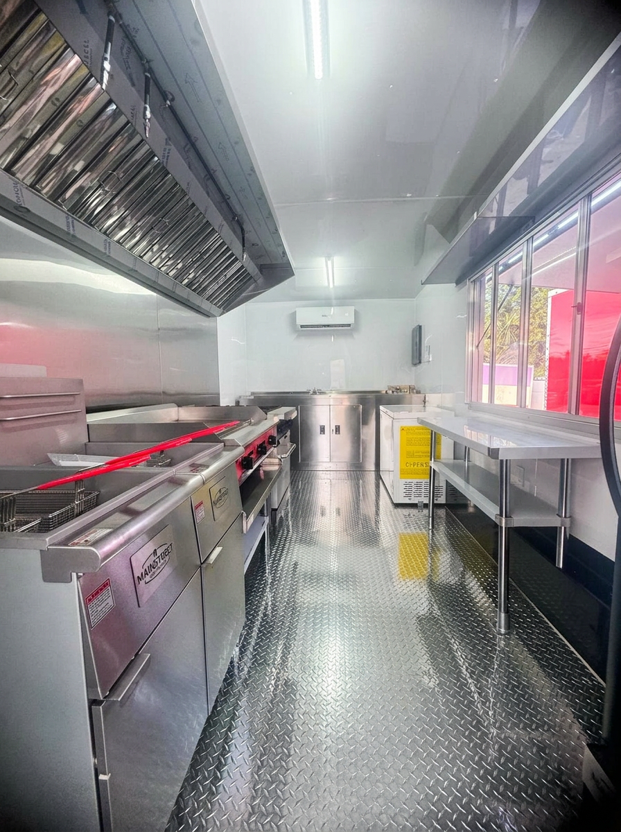 Stainless steel commercial kitchen interior of a food trailer